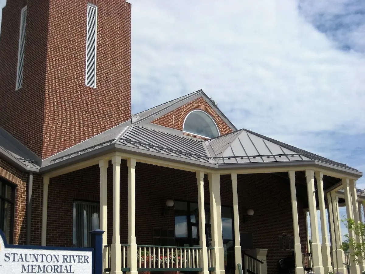 Skilled roofing craftsmen working on a residential roof in Mooreville